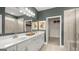 Double vanity bathroom with a large shower and linen closet at 749 Myrica Ave # 208, Locust Grove, GA 30248