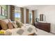 Bright bedroom with large windows and a modern dresser at 749 Myrica Ave # 208, Locust Grove, GA 30248