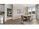 Spacious dining area with hardwood floors and views into a bedroom at 749 Myrica Ave # 208, Locust Grove, GA 30248