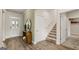 Inviting entryway with wood-look floors and a coat closet at 749 Myrica Ave # 208, Locust Grove, GA 30248