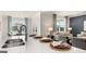 Modern kitchen with island and stainless steel appliances, open to living area at 749 Myrica Ave # 208, Locust Grove, GA 30248