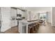 Modern kitchen with island, white cabinets, and stainless steel appliances at 749 Myrica Ave # 208, Locust Grove, GA 30248