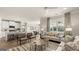 Open living room features stylish furniture, and a view into the kitchen area at 749 Myrica Ave # 208, Locust Grove, GA 30248