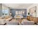 Bright and airy living room with a feature wall and comfortable seating at 749 Myrica Ave # 208, Locust Grove, GA 30248