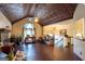 Spacious living room features a unique tin ceiling, hardwood floors, and a cozy fireplace at 402 Stonebrooke Dr, Auburn, GA 30011