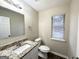 Clean bathroom with granite countertop and updated fixtures at 3880 Springleaf Ct, Stone Mountain, GA 30083