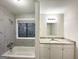 Modern bathroom with a shower/tub combo and granite countertop at 3880 Springleaf Ct, Stone Mountain, GA 30083