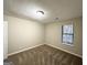 Bright bedroom with neutral walls and carpet flooring at 3880 Springleaf Ct, Stone Mountain, GA 30083