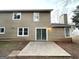 Tan two story home with sliding glass doors and patio at 3880 Springleaf Ct, Stone Mountain, GA 30083
