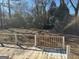 Deck overlooking a large, grassy backyard with mature trees at 285 Queen Helen Ln, Jonesboro, GA 30236