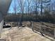 Wooden deck with white railings, overlooking backyard at 285 Queen Helen Ln, Jonesboro, GA 30236