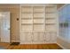 Built-in shelving unit with cabinets offers ample storage space at 155 Island Shoals Rd, Covington, GA 30016