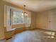 Bright dining area with built-in window seat and view at 155 Island Shoals Rd, Covington, GA 30016