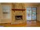 Stone fireplace is a focal point with wood mantel and hearth at 155 Island Shoals Rd, Covington, GA 30016