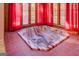 Relaxing hot tub in a sunroom with red curtains at 155 Island Shoals Rd, Covington, GA 30016