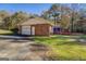 Ranch house with brick exterior, attached garage, and screened porch at 155 Island Shoals Rd, Covington, GA 30016