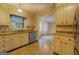 Galley kitchen with light wood cabinets and stainless steel appliances at 155 Island Shoals Rd, Covington, GA 30016