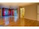 Open living room with hardwood floors and access to bathroom and hot tub at 155 Island Shoals Rd, Covington, GA 30016