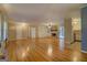 Open living area with hardwood floors, stone fireplace and access to patio at 155 Island Shoals Rd, Covington, GA 30016