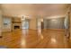 Living room features hardwood floors, stone fireplace, and built-in shelving at 155 Island Shoals Rd, Covington, GA 30016