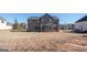 Large backyard with a two-story home and basketball goal visible at 160 Traditions Ln, Hampton, GA 30228