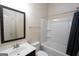 Simple bathroom with single vanity and tub shower at 160 Traditions Ln, Hampton, GA 30228
