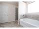 Bathroom with shower and garden tub at 160 Traditions Ln, Hampton, GA 30228
