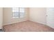 Spacious bedroom with large window and neutral decor at 160 Traditions Ln, Hampton, GA 30228