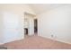 Spacious bedroom with neutral carpeting and access to a private bathroom at 160 Traditions Ln, Hampton, GA 30228