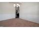 Formal dining room with decorative chair railing and access to kitchen at 160 Traditions Ln, Hampton, GA 30228