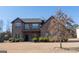 Brick two-story house with landscaping and a large yard at 160 Traditions Ln, Hampton, GA 30228