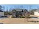 Two-story house with a covered porch and landscaping at 160 Traditions Ln, Hampton, GA 30228