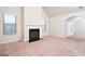 Living room features a fireplace and vaulted ceiling at 160 Traditions Ln, Hampton, GA 30228