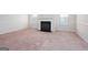 Spacious living room featuring a cozy fireplace and large windows at 160 Traditions Ln, Hampton, GA 30228