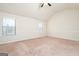 Large main bedroom with vaulted ceiling and two windows at 160 Traditions Ln, Hampton, GA 30228