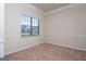 Bright home office features neutral walls and carpet at 160 Traditions Ln, Hampton, GA 30228