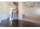 Elegant staircase with dark wood flooring and wrought iron railing at 160 Traditions Ln, Hampton, GA 30228
