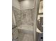 Bright bathroom featuring a tiled shower-over-tub combination with a built-in soap niche at 213 W Hightower Trl, Social Circle, GA 30025