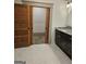 Bathroom featuring a wooden sliding door and marble flooring at 213 W Hightower Trl, Social Circle, GA 30025