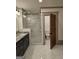 Main bathroom with double vanity, large shower, and separate toilet area at 213 W Hightower Trl, Social Circle, GA 30025