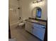 A bathroom with a shower-tub combination, white subway tiles, and a vanity with a marble countertop at 213 W Hightower Trl, Social Circle, GA 30025
