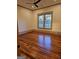 Bedroom with a ceiling fan and hardwood floors at 213 W Hightower Trl, Social Circle, GA 30025