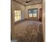 Sunlit bedroom with neutral walls and carpet, a ceiling fan and window at 213 W Hightower Trl, Social Circle, GA 30025
