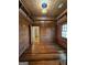 Stylish bedroom features wood-paneled walls and a vintage-inspired stained glass lighting fixture at 213 W Hightower Trl, Social Circle, GA 30025