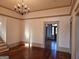 Open dining room with hardwood floors and traditional lighting at 213 W Hightower Trl, Social Circle, GA 30025
