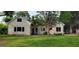Charming home with a well-manicured lawn and mature trees in a quiet neighborhood at 213 W Hightower Trl, Social Circle, GA 30025