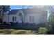 Light beige craftsman home, nicely landscaped at 213 W Hightower Trl, Social Circle, GA 30025