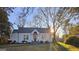 Charming home with manicured front yard featuring an inviting entrance and abundant sunlight at 213 W Hightower Trl, Social Circle, GA 30025