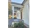 Inviting front porch with detailed woodwork and lighting at 213 W Hightower Trl, Social Circle, GA 30025