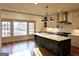 Bright kitchen with a center island, modern appliances, and a large window overlooking the backyard at 213 W Hightower Trl, Social Circle, GA 30025